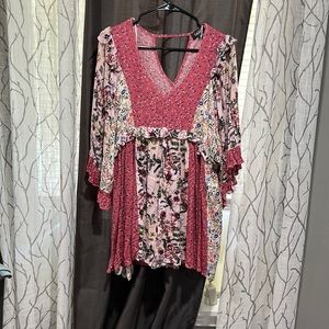 Mini dress v neck small open back. Very Flowy  multiple prints